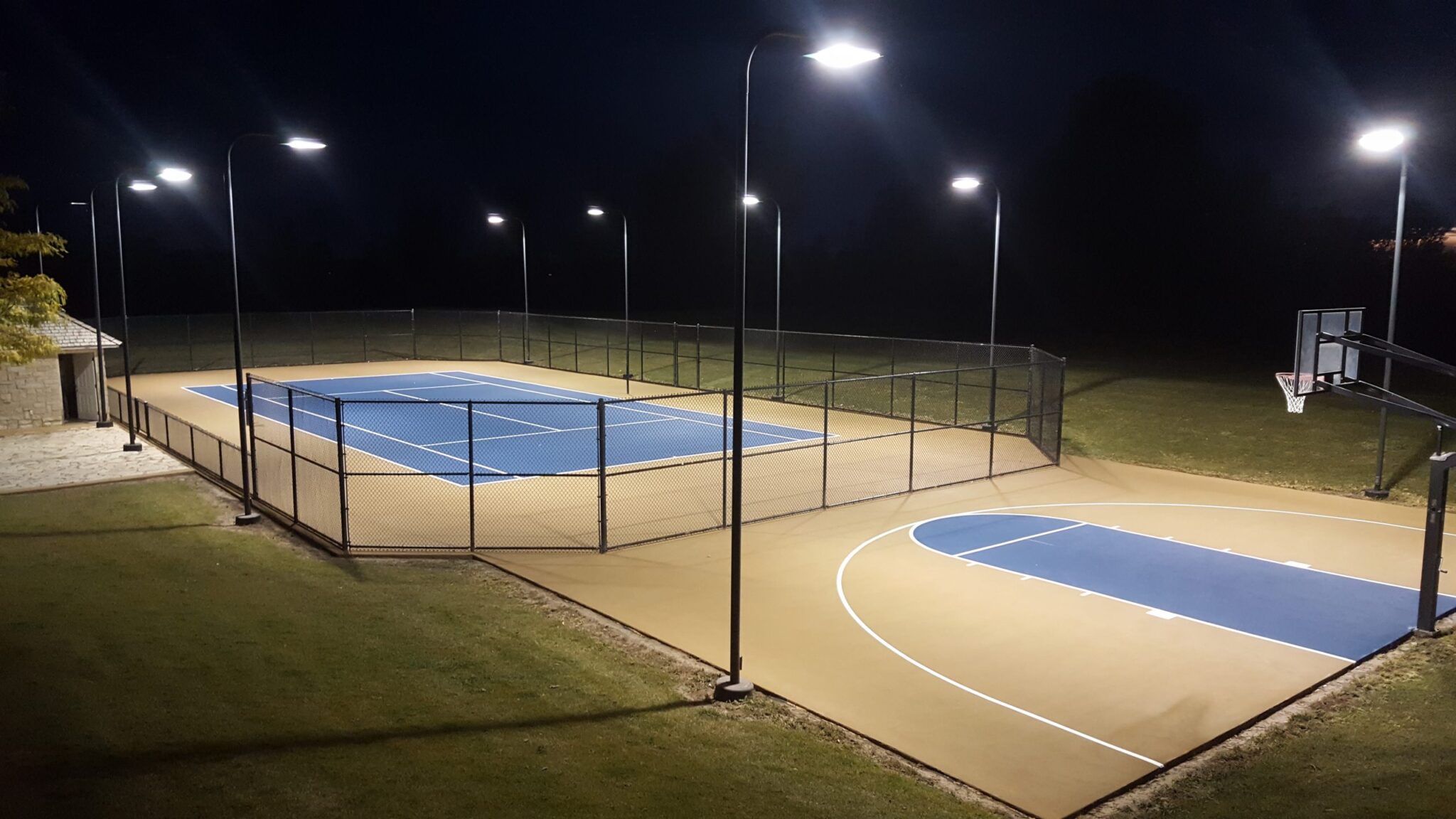New outdoor tennis and basketball court under the lights.