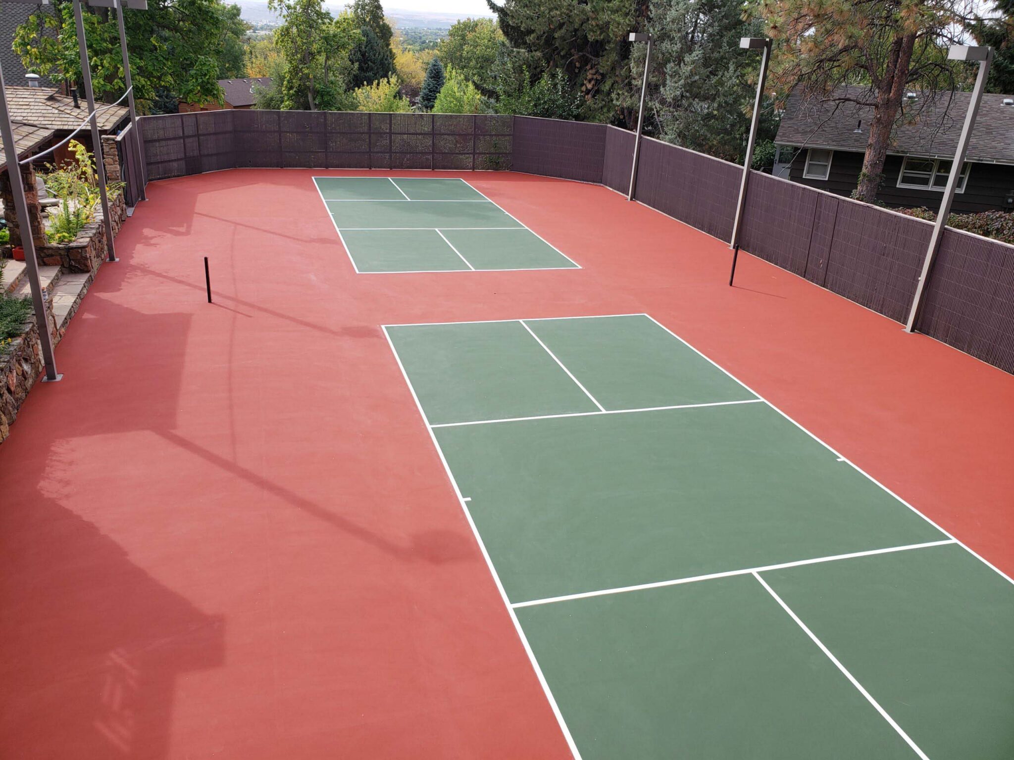 New pickleball courts with red and green colors and white lines.